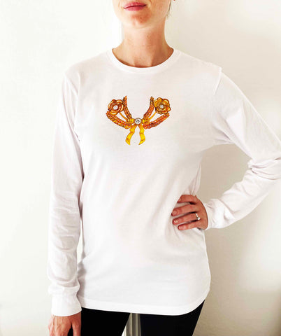 white tee shirt with printed gold brooch long sleeves