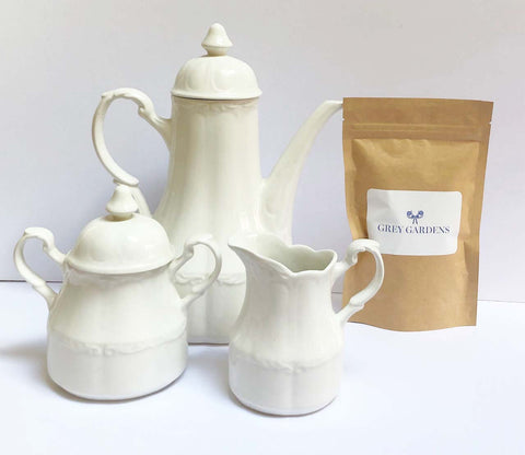 White ironstone 5 piece tea set with packaged tea